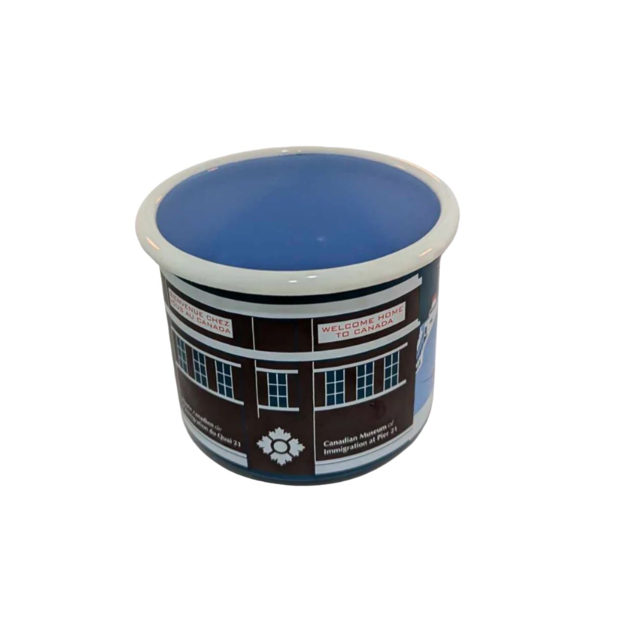 Center view of enamel mug with artistic representation of a ship docked outside Pier 21 in blues, brown and red