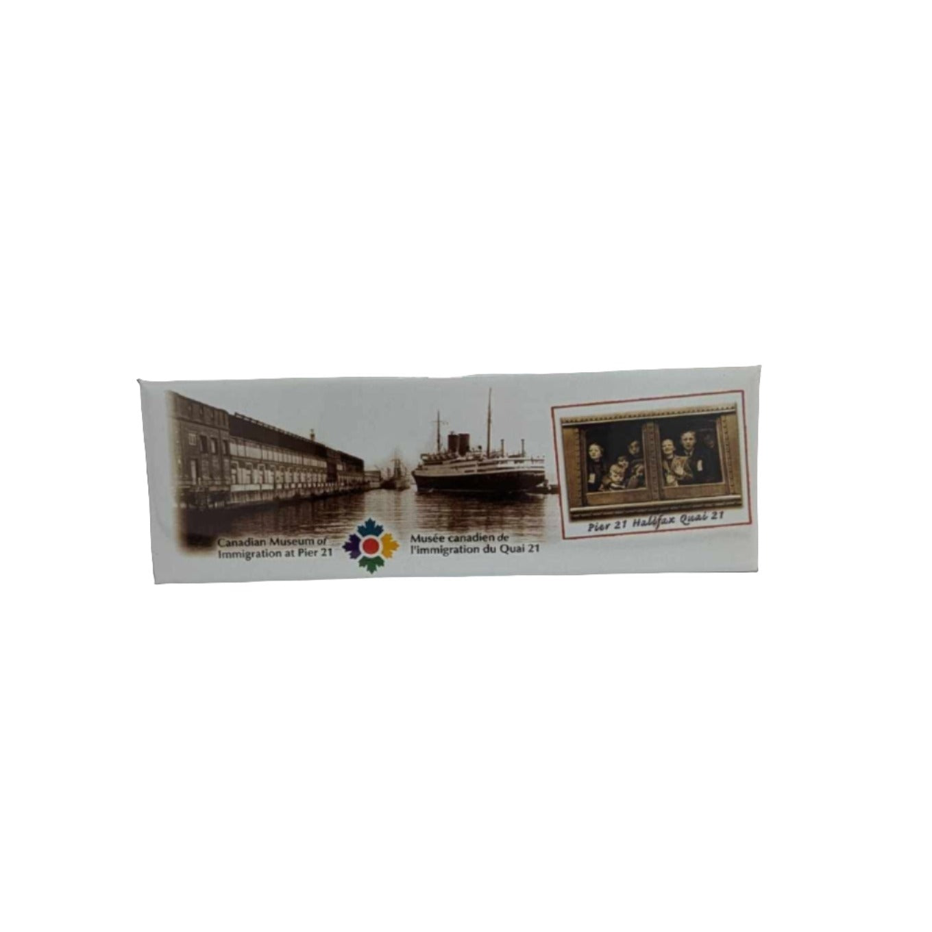 White magnet with black and white image of Berlin II docking at Pier 21 with inset image of children on a train and the Canadian Museum of Immigration logo at the bottom