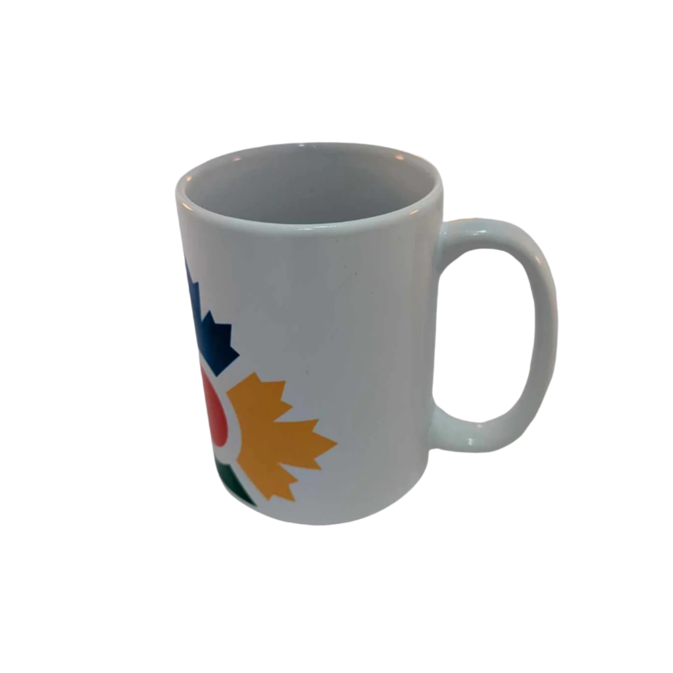Right side of tall, white mug with partial image of colourful icon with blue, yellow and green maple leaves shown and the red circle in the middle