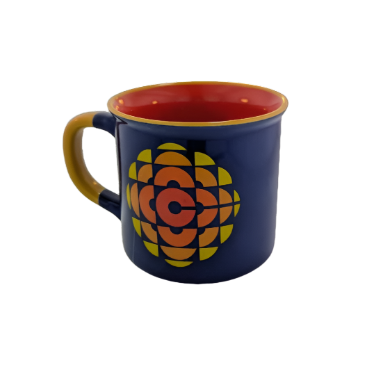 Left side view of blue mug with 1974 CBC logo in the center in reds, oranges and yellows with a red interior and yellow details 