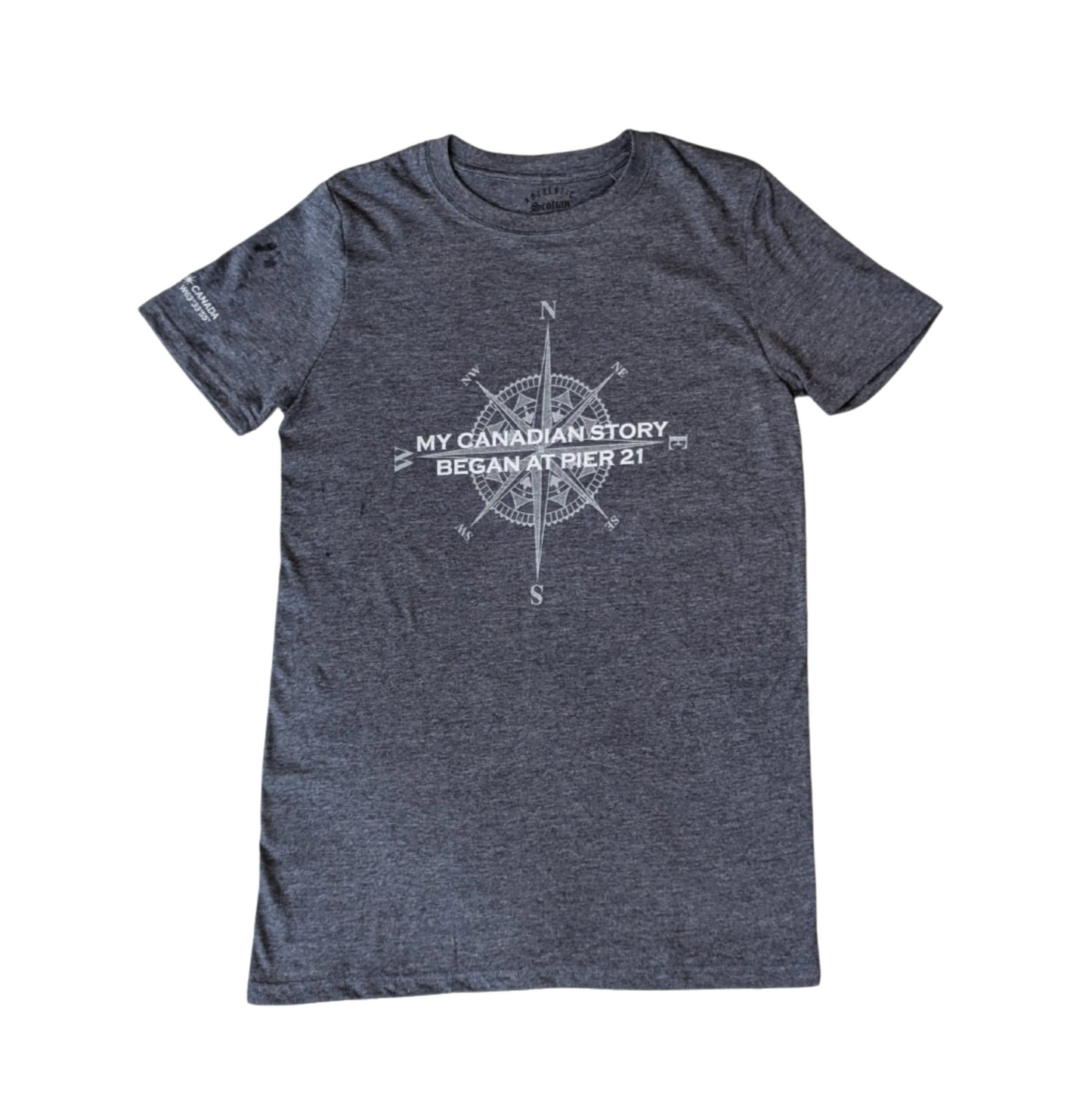 Grey, short-sleeved t shirt with words My Canadian Story Began at Pier 21 across a compass rose