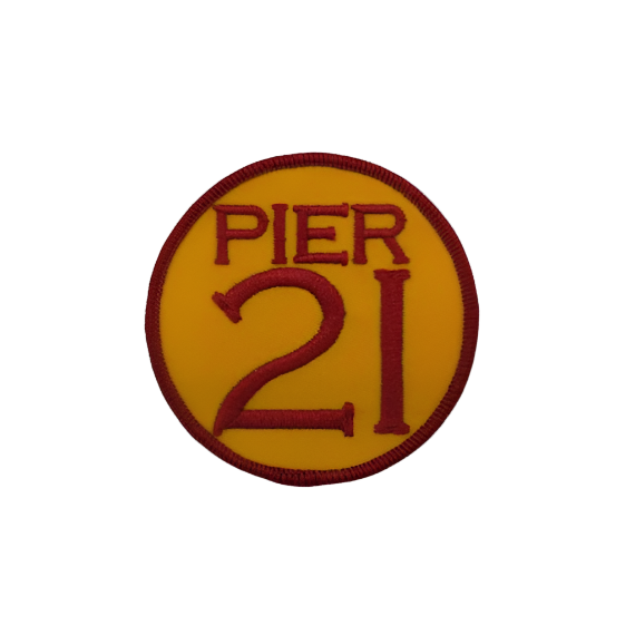 Round golden-yellow patch with deep embroidery, Pier 21 