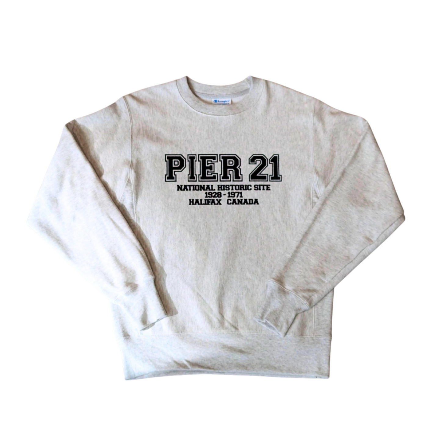 Heather grey long-sleeved sweatshirt with Pier 21 in varsity-style lettering and National History Site 1928-1971 Halifax Canada below 